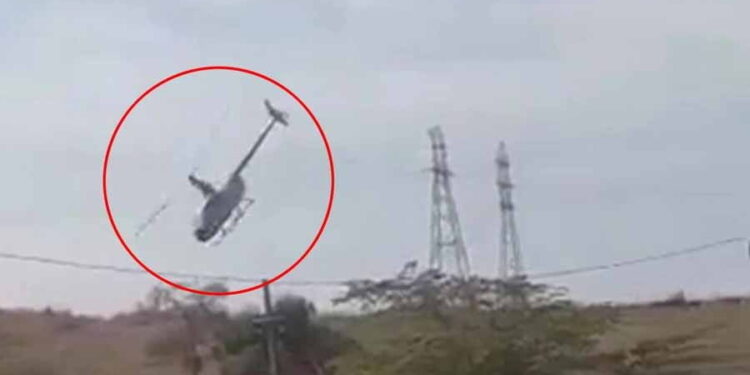 Helicopter entangled with electric wires